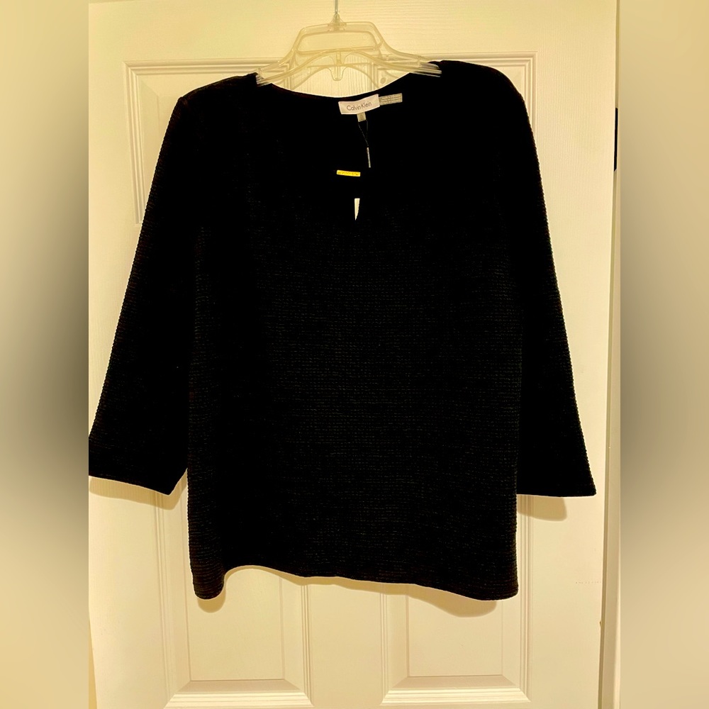 New black top, 3/4 sleeve. Brand new with tags.